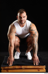 Whole Body Man White Sports Shorts Muscular Kneeling Top Studio photo references